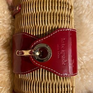 Kate Spate clutch bag red leather and rattan.